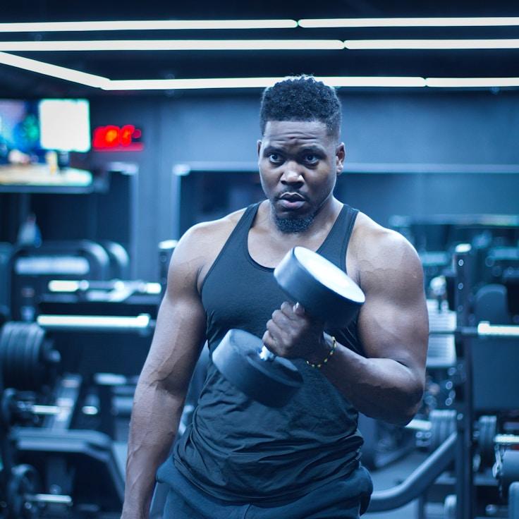 Interior of a professional gym with weight training equipment and mirrors